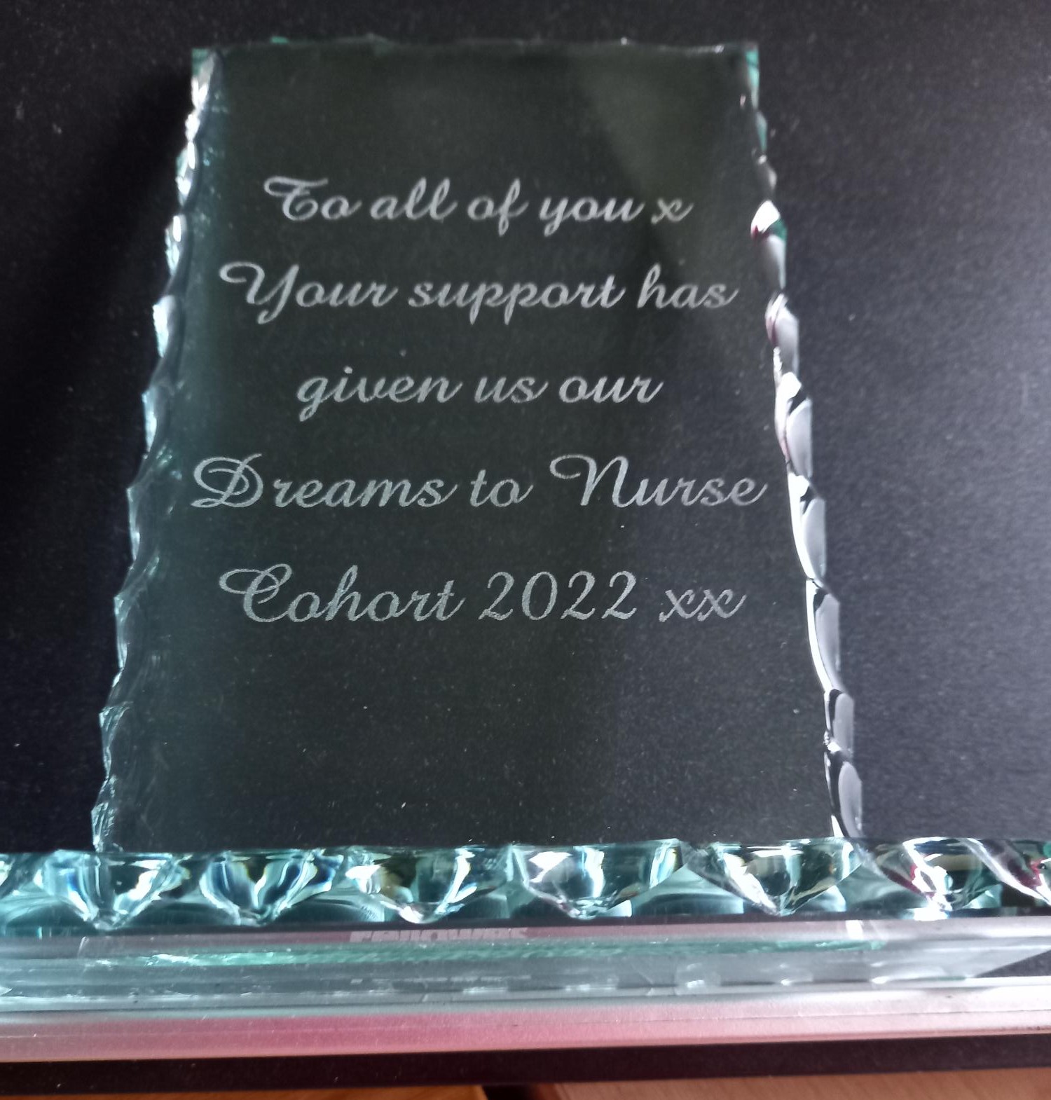 A glass ornament etched with a supportive and inspiring message from Nurse Cohort 2022