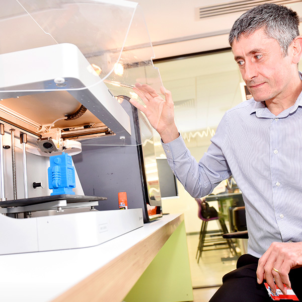 A member of staff using our 3D printer facilities