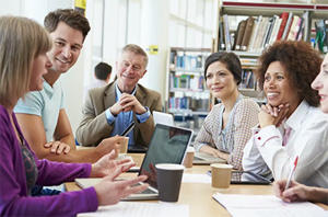 Group of people sitting in a meeting