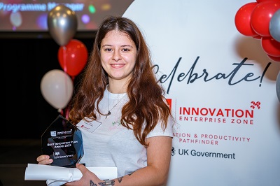 Briana Turcan holding her award