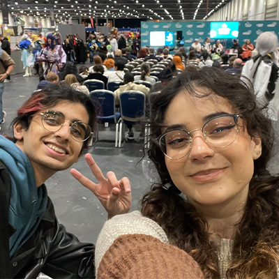 A male and female student taking a selfie together.