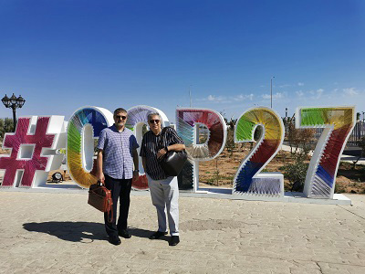 The Professors stood in front of giant COP27 letters