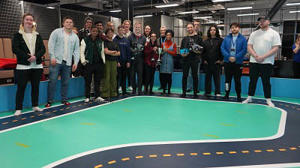 People standing on an indoor race track