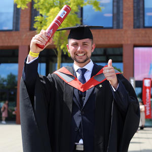 Ellis Rogers-Byrne in his graduation cap and gown