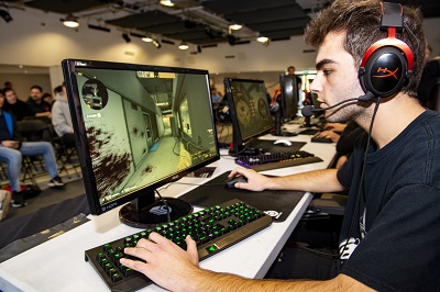 Student sat playing computer games