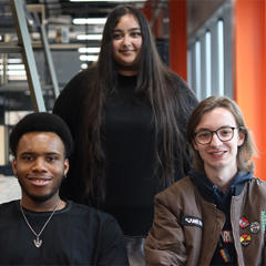 A group of students smiling at the camera.