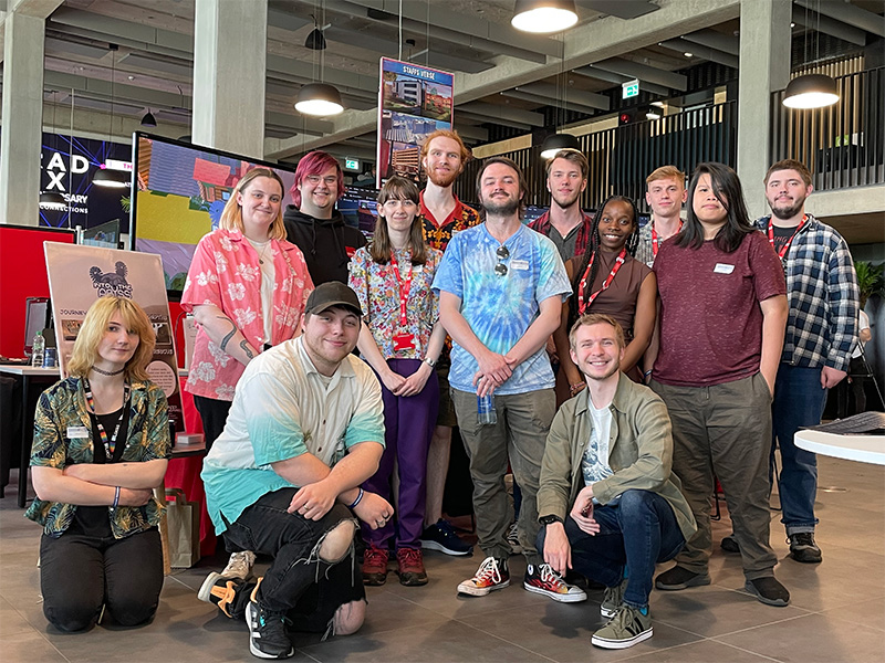 A group of Staffordshire University students in front of their stand at Game Republic 