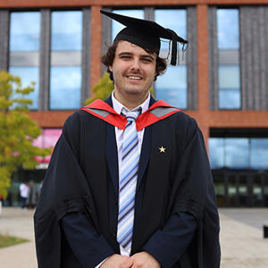 Kyle Ashbee wearing his graduation cap and gown