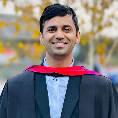 A male student in his graduation gown