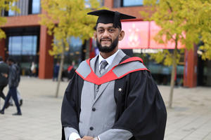 Naser Rashid in his graduation cap and gown