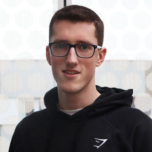 A male student wearing glasses.