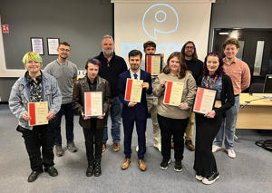 The group of students holding certificates 