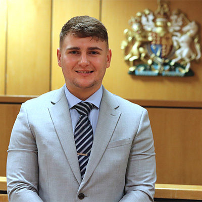 Ryan Zwetschnikow photographed in the mock law court on campus