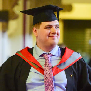 Thomas Whitelegg in his graduation cap and gown