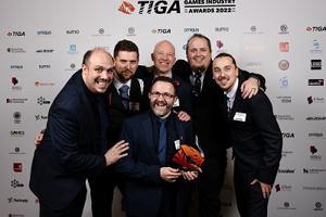 A group of six Games lecturers with their award at the TIGA Games Industry Awards