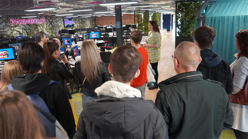 Students and parents are having a campus and facilities tour in the University of Staffordshire London building